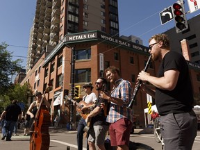 The Misery Mountain Boys perform for a crowd of people enjoying an outdoor brunch at the City Market Downtown in Edmonton, on Saturday, June 16, 2018.