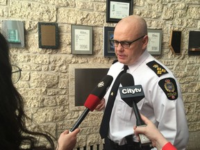 Edmonton police Chief Dale McFee speaks to reporters outside a police commission meeting on March 21, 2019.
