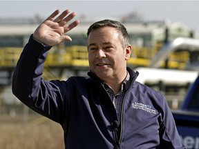 Alberta UCP Leader Jason Kenney waves to passing motorists outside the TransMountain Edmonton Terminal where he unveiled the UCP Fight Back Strategy against foreign anti-oil special interests on March 22, 2019.