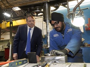 UCP Leader Jason Kenney (left) watches Universe Machine Co. drill press operator Gagandeep Singh at work on Wednesday March 6, 2019, where Kenney also announced his red tape reduction plan.