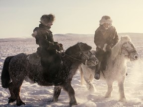 Niobe Thompson, left, with Yakut horse herder near Oymyakon, Siberia, in Equus: Story of the Horse.