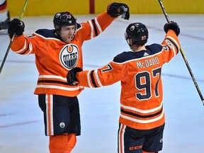 Edmonton Oilers Connor McDavid (97) celebrates with Leon Draisaitl (29) after scoring a hit trick against the Calgary Flames during the season opener of NHL action at Rogers Place in Edmonton, October 4, 2017.