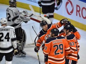 Edmonton Oilers Ryan Nugent-Hopkins (93) gets congratulated by teammates after scoring a hat trick in the first period against the Los Angeles Kings during NHL action at Rogers Place in Edmonton, March 26, 2019.