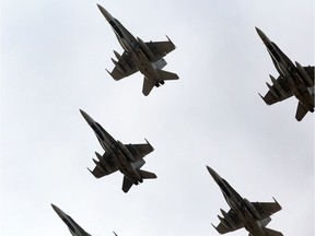Six CF-18 Hornet fighter jets takes off from 4 Wing Cold Lake on Tuesday, October 21, 2014. The Canadian Armed Forces are providing the fighter jets to lend a hand in the fight against ISIS in Iraq.