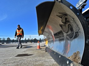 Andrew Grant, general supervisor for Infrastructure field operations, walks past a snow blade after saying residential street blading will commence at 11 p.m. Wednesday, on March 6, 2019.