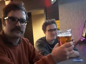 Tim Mikula (left) enjoys a refreshing "Canadian" with a compatriot at Hawkeyes Too.