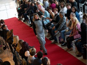 A model walks the runway during the Every Body's Beautiful fashion show at Lexus of Edmonton on Thursday, April 18.