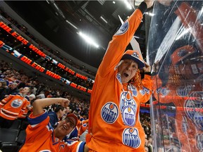 Fans celebrate Edmonton Oilers' Leon Draisaitl game-winning goal over the New York Rangers during a NHL game at Rogers Place in Edmonton, on Monday, March 11, 2019.