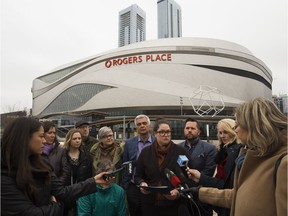 Edmonton Public School Board vice chair Bridget Stirling (centre) and other Alberta school board trustees speak to the media, as they call on the provincial political parties to commit to funding enrolment growth, outside Rogers Place in Edmonton Monday March 25, 2019.