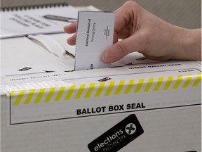 Elections Alberta Director of Operations and Communications Pamela Renwick demonstrates how advance polls in the provincial general election will be used, during a press conference in Edmonton Tuesday March 26, 2019. On Aug. 23, 2021, the Alberta Court of Queen's Bench agreed to reduce a fine levied against a woman who voted in the 2019 election despite not being a Canadian citizen.