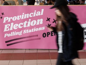 A student passes by a pro-voting sign placed by LicencetoComplain.ca, a students' union get out the vote organization, in the Students' Union Building at the University of Alberta in Edmonton, on Wednesday, April 10, 2019.
