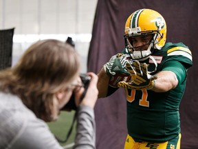 Edmonton Eskimos photographer Dale MacMillan shoots an advertising campaign for the CFL team with Eskimos fullback Calvin McCarty at Commonwealth Recreation Community Centre in Edmonton, on Thursday, April 11, 2019. The team plays their first preseason game at Commonwealth Stadium on May 26 against the BC Lions.