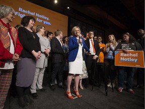 Alberta NDP Leader Rachel Notley holds her husband Lou Arab's hand as she gives her concession speech at the NDP election night event at the Edmonton Convention Centre, Tuesday April 16, 2019.