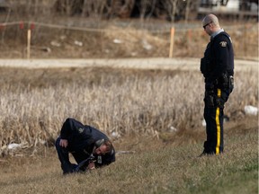 RCMP officers investigate a fatal motorcycle crash on the on ramp to southbound Anthony Henday Drive in Sherwood Park, on Saturday, April 20, 2019. Photo by Ian Kucerak/Postmedia