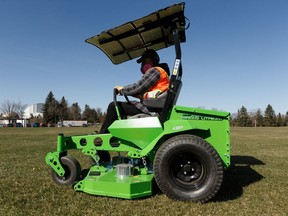 Maurice Pelletier, an open space operations team lead with the City of Edmonton, demonstrates how a new electric lawn mower works at a news conference on the status of sports fields at Coronation Park in Edmonton, on Thursday, April 25, 2019.