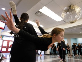 Alecia Hack (right) dances with fellow students during a flash mob held on International Dance Day at Victoria School of the Arts in Edmonton, on Monday, April 29, 2019.