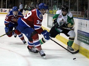 Edmonton Oil Kings centre Andrew Fyten battles Raiders defenceman Sergei Sapego for the puck during first-period action of Game 5 of the WHL Eastern Conference Final Friday, April 26, 2019 at the Art Hauser Centre in Prince Albert, Saskatchewan. Lucas Punkari/Prince Albert Herald