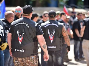 Soldiers of Odin members stand guard at an anti-Islam rally at Calgary city hall on Saturday, June 3, 2017.