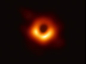 A handout photo provided by the European Southern Observatory on April 10, 2019 shows the first photograph of a black hole and its fiery halo, released by Event Horizon Telescope astronomers (EHT), which is the "most direct proof of their existence," one of the project's lead scientists told AFP.