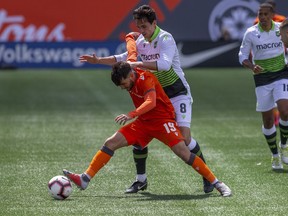 Forge FC midfielder Tristan Borges, left, defends the ball from York 9 midfielder Joseph Di Chiara during the inaugural soccer match of the Canadian Premier League between Forge FC of Hamilton and York 9 in Hamilton, Ont., Saturday, April 27, 2019.