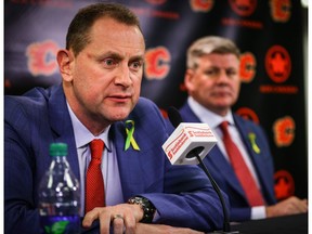 Calgary Flames GM Brad Treliving and the teams new head coach Bill Peters during a press conference in the Ed Whalen Media Lounge at the Scotiabank Saddledome in Calgary.