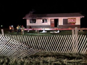 Firefighters tackle a fire at a modular home in Leduc. (Photo supplied/RCMP)