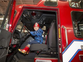Elijah Fernandez, 3, tests out a fire truck during the official reopening of Rossdale Fire Station 21 on Saturday, April 27, 2019, in Edmonton . Rossdale Fire Station was built in 1949, but closed in the late 1990s. The station has been renovated to meet current Edmonton Fire Rescue standards. Rossdale Fire Station will provide fire rescue backup to the downtown core and will serve as a dedicated river rescue station.