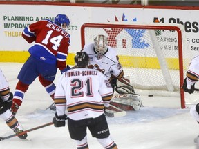 Calgary Hitmen goalie Jack McNaughton is scored on by Edmonton Oil Kings Quinn Benjafield in first period WHL Eastern Conference Semi-Final action at the Scotiabank Saddledome in Calgary on Wednesday, April 10, 2019.