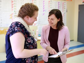 Shannon Phillips, NDP candidate for Lethbridge-West, speaks with organizer Joy Shand in her campaign office on April 4, 2019.