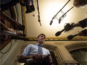 Canadian Prime Minister Justin Trudeau speaks with media before caucus on Parliament Hill in Ottawa, Wednesday, April 3, 2019.