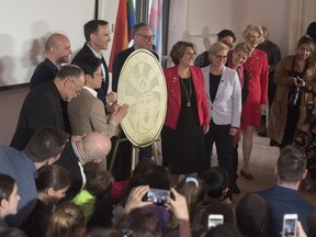 The Royal Canadian Mint unveils the new one-dollar coin honouring the progress made in the journey to equal rights for LGBTQ2 Canadians at a press conference in Toronto on Tuesday, April 23, 2019.