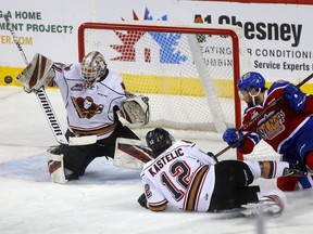 Calgary Hitmen goalie, Jack McNaughton makes a save on a Edmonton Oil Kings shot in first period WHL Eastern Conference semi-Final action at the Scotiabank Saddledome in Calgary on Tuesday, April 9, 2019.