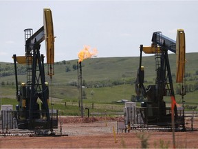 Oil pumps and natural gas burn off in Watford City, N.D. File photo.