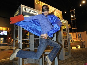 Renee Kowalski-Selsky leaps out of a phone booth while taking the Superhero Quick Change Challenge at MythBusters: The Explosive Exhibition on Thursday April 25, 2019. The exhibit is on at the Telus World of Science in Edmonton until September 2, 2019. The exhibition creates hands-on, interactive experiences for guests of all ages by combining popular scientific facts with innovative, family-friendly displays. (PHOTO BY LARRY WONG/POSTMEDIA)