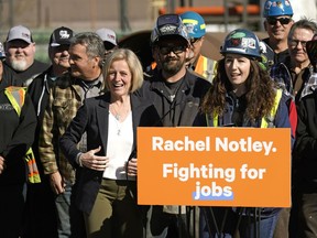 Alberta NDP Leader Rachel Notley meets with tradespeople at the Local Union 488 yard during a campaign stop in Edmonton on Monday, April 8, 2019.