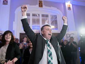 Progressive Conservative leader Dennis King, accompanied by his wife Jana Hemphill, left, arrives to greet supporters after winning the Prince Edward Island provincial election in Charlottetown on April 23, 2019.