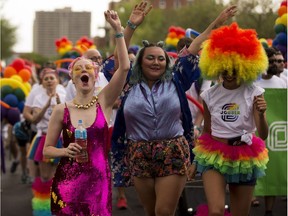 Participants take part in the Edmonton Pride parade on Saturday, June 9, 2018.