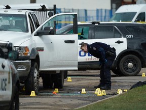 Edmonton police investigate a shooting near 105 Avenue and 100 Street on April 30, 2019. Photo by Larry Wong/Postmedia