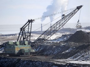 A giant drag line works in the Highvale Coal Mine to feed the nearby Sundance Power Plant near Wabamun on March 21, 2014.