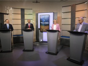 United Conservative Party leader Jason Kenney, left to right, Alberta Liberal Party leader David Khan, Alberta New Democrat Party leader and incumbent premier Rachel Notley and Alberta Party leader Stephen Mandel take their places during the 2019 Alberta Leaders Debate at the CTV Edmonton studio in Edmonton, Alta., on Thursday, April 4, 2019.