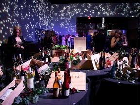 People check out the wine table during the YESS Gala for Youth at the Edmonton Convention Centre on Friday, April 26.