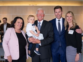 MacEwan University president emeritus Paul Byrne, middle, is pictured holding his 17-month-old grandson Colton. On the left is his wife Nancy Byrne, and on the right are his son Jason Byrne and daughter-in-law Helena Byrne (both MacEwan grads).