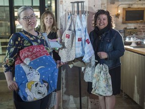 From left, Suzanne Dennis, Cindy Lazarenko and Joveena Holmes. Dennis is a community volunteer who has created a program called BoomerangBagYEG, which sees volunteers making shopping bags and produce bags from used fabric. Dennis stocks racks with free bags at two stores, including Lazarenko's Culina-To-Go.