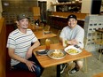 Roel Canafranca (left) and Ariel del Rosario have turned their food truck and food court business into a new restaurant, serving Filipino and southeast Asian cuisine at 10621-100 Avenue in downtown Edmonton..
