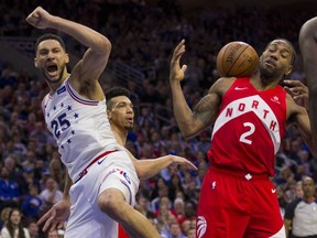 Ben Simmons of the Philadelphia 76ers, left, reacts in front of Kawhi Leonard of the Toronto Raptors after dunking the ball in the third quarter of Game Six of the Eastern Conference Semifinals at the Wells Fargo Center on May 9, 2019 in Philadelphia.
