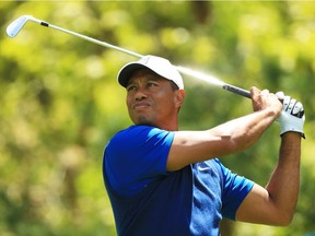 Tiger Woods plays his shot from the eighth tee during the first round of the 2019 PGA Championship at the Bethpage Black course on May 16, 2019 in Farmingdale, N.Y.