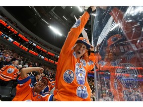 Fans celebrate Edmonton Oilers' Leon Draisaitl (29) game winning goal over the New York Rangers during a NHL game at Rogers Place in Edmonton, on Monday, March 11, 2019.