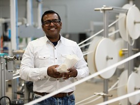 Mickey Gois, president of Royal Paper Industries, poses with paper straws at the company's factory in Edmonton, on Friday, May 3, 2019.