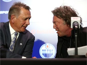 Ken Holland (left), general manager of the Edmonton Oilers, shakes hands with Daryl Katz, owner of the Edmonton Oilers, during a press conference announcing Holland's hiring at Rogers Place in Edmonton, on Tuesday, May 7, 2019.