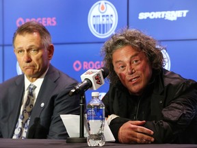 Ken Holland (left), general manager of the Edmonton Oilers, listens as Daryl Katz, owner of the Edmonton Oilers, speaks during a press conference announcing Holland's hiring at Rogers Place in Edmonton, on Tuesday, May 7, 2019.